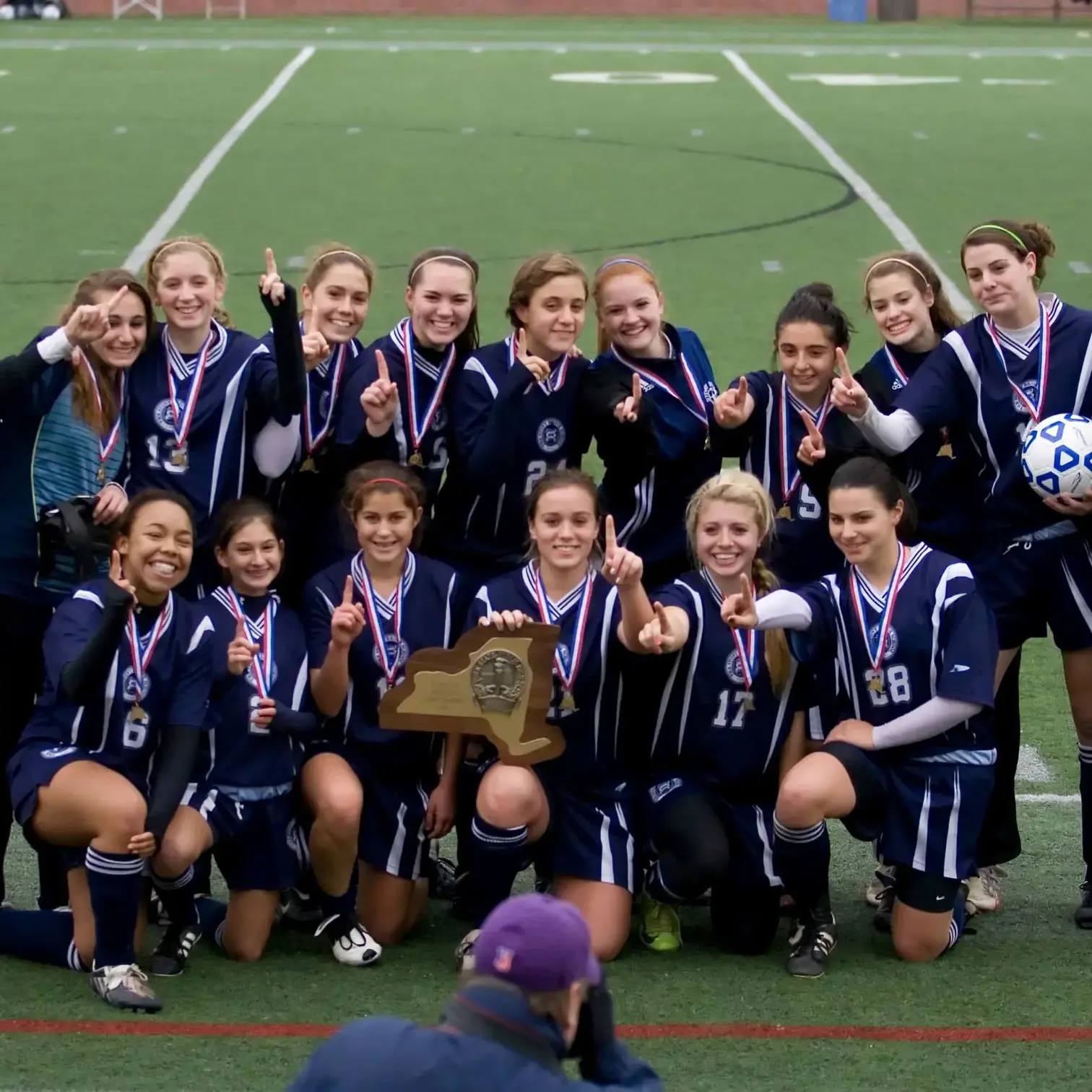 Student soccer team posing